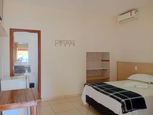 Ένα ή περισσότερα κρεβάτια σε δωμάτιο στο Chalés de São Pedro