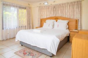 Postel nebo postele na pokoji v ubytování mck lodge ltd + 29 fotografií