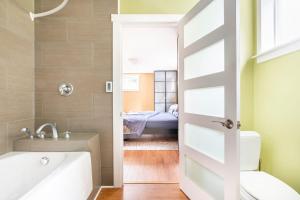 a bathroom with a door leading to a bedroom at Fresh Space Quiet Air Studio in Mercer Island +13 photos