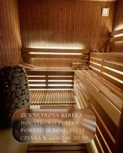 an empty sauna with a sign in the middle at Targowa37 Uniejow in Uniejow