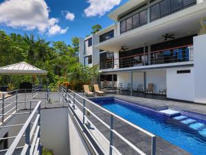 an image of a house with a swimming pool at Casa Cielo Luxury Jungle Retreat, Manuel Antonio in Quepos
