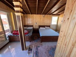 Postel nebo postele na pokoji v ubytování white dune camp