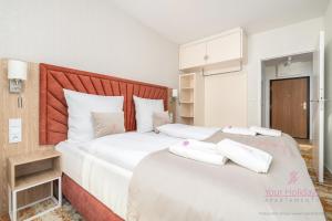 Кровать или кровати в номере Your Holidays Bel Mare Aqua F234 +7 фотографий