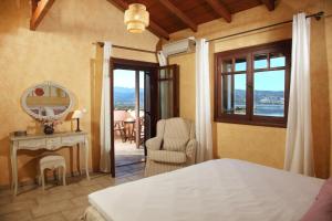 Postel nebo postele na pokoji v ubytování AVLEMONAS Nature Retreat View to Lefkada + 29 fotografií