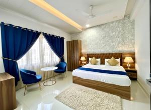 Ένα ή περισσότερα κρεβάτια σε δωμάτιο στο Hotel Elegant Bellemount Plaza A Family Hotel