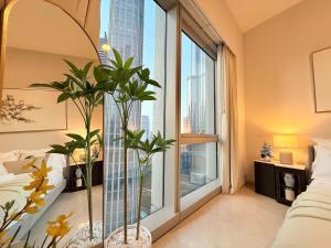 Ένα ή περισσότερα κρεβάτια σε δωμάτιο στο SVG - UNIQUE BURJ KHALIFA & FOUNTAIN ViEW-4 BR +67 φωτογραφίες