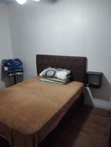 Postel nebo postele na pokoji v ubytování Refúgio da Praia - Tramandaí