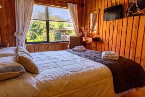 Postel nebo postele na pokoji v ubytování Cabañas Entre Verdes