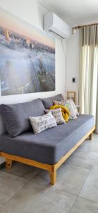 a couch with pillows on it in a room at Departamento céntrico Crespo in Santa Fe