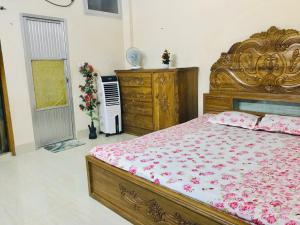 Postel nebo postele na pokoji v ubytování Sreemangal Nest