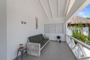 a balcony with a couch and a table at Fuente Verde in Fontein +37 photos