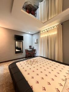 En eller flere senge i et værelse på Motel Vitoria Reggia