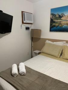 Ένα ή περισσότερα κρεβάτια σε δωμάτιο στο Suíte Teahupoo - Pousada