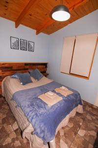 En eller flere senge i et værelse på Cabaña Mara