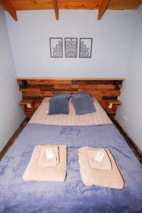 En eller flere senge i et værelse på Cabaña Mara