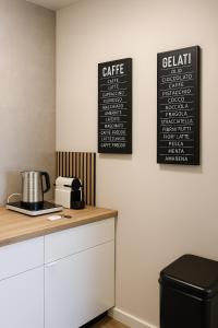 a kitchen with a counter and a chalkboard on the wall at Apartments KR in Cologne