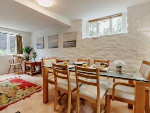 a dining room with a table and chairs at 3 Bed in Machynlleth 93083 in Cemmaes