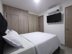 TV a/nebo společenská místnost v ubytování Casa en Santa Marta