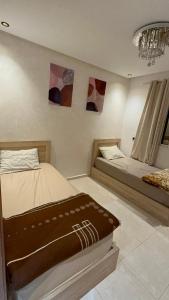 Ένα ή περισσότερα κρεβάτια σε δωμάτιο στο appart 206