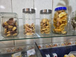 a bunch of jars filled with different types of food at Hotel Paraiso Belém in Belém +10 photos
