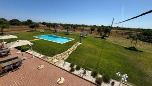 an aerial view of a yard with a swimming pool at Vila Fuzeta Bed&Breakfast in Fuzeta