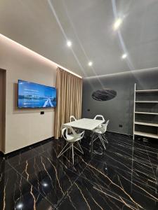 Μια τηλεόραση ή/και κέντρο ψυχαγωγίας στο Elite holiday apartments Catanzaro