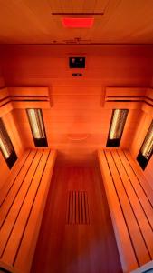 a sauna with two wooden benches in a room at Statek Honezovice ze saunou in Honezovice +1 photo