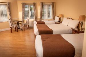 Postel nebo postele na pokoji v ubytování Óstán Loch Altan