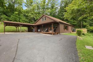 a house with a large driveway in front of it at Lakefront in Logan (In the heart of Hocking Hills) in Logan