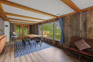 a dining room with a wooden table and chairs at Lakefront in Logan (In the heart of Hocking Hills) in Logan