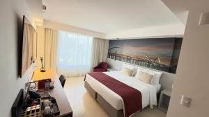 a hotel room with a bed and a bridge painting on the wall at Fabuloso Hotel Alvorada - Apt da Rede Premium in Brasilia +14 photos