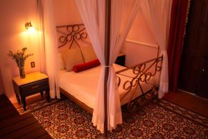 Ένα ή περισσότερα κρεβάτια σε δωμάτιο στο La Casa Rosa Imperial +17 φωτογραφίες