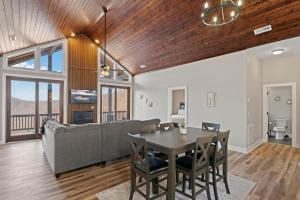 a living room with a couch and a table at Mountain View 4 Units - Mountain Retreat, 8BR, Views, Near Smokies in Cullowhee