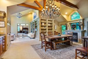 a dining room with a table and a chandelier at Daisy Glen Retreat - Amazing Indoor Pool in South Bloomingville