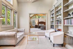 a living room with a couch and a table at Daisy Glen Retreat - Amazing Indoor Pool in South Bloomingville +34 photos