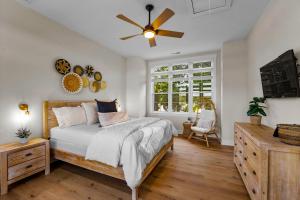 a bedroom with a bed and a ceiling fan at Hogan Crest in Mooresville +77 photos