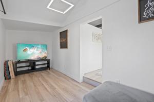 a living room with a couch and a tv at The Shack in Buckeye Lake