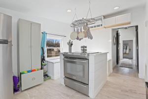 a kitchen with a counter and a stove top oven at The Shack in Buckeye Lake