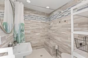 a bathroom with a sink and a toilet and a shower at The Shack in Buckeye Lake +23 photos