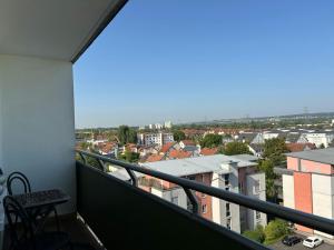 a balcony with a view of a city at Central Studio for 2 in Hattersheim