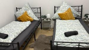 two bunk beds with pillows on them in a room at CCH comfort Bremerhaven in Bremerhaven