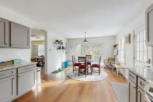 a kitchen and dining room with a table and chairs at Private Waterfront Retreat in Edgecomb