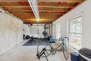 a bike parked in a room with a gym at Private Waterfront Retreat in Edgecomb