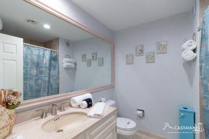 a bathroom with a sink and a large mirror at Sonoran Spa E204 in Puerto Peñasco +16 photos