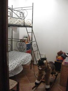 a room with two bunk beds and a stuffed animal at Appartamento Nosside in Locri
