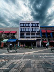 a building with two benches in front of it at Priede Hotel Boutique in Puebla