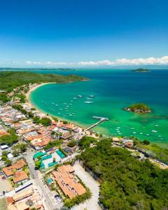 an aerial view of a beach with boats in the water at Suri Búzios Hotel in Búzios +36 photos
