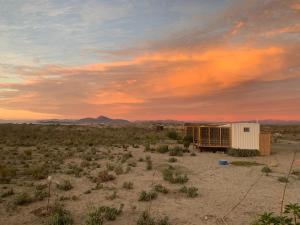 a building in the middle of the desert at Cabañas ecológicas Tongoy in Tongoy