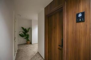 a wooden door in a room with a sign on it at Royal Regency Eg Hotel in Cairo +3 photos