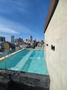a swimming pool on the roof of a building at Casa Joseph in Buenos Aires